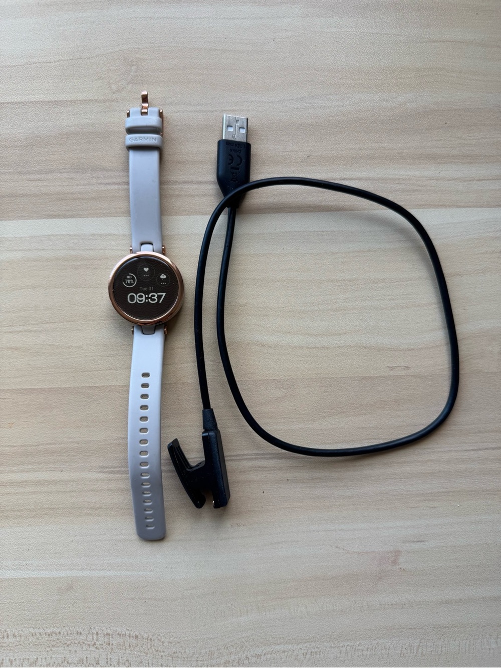 garmin Lily Sport Rose Gold Smartwatch with Light Beige Band and charger